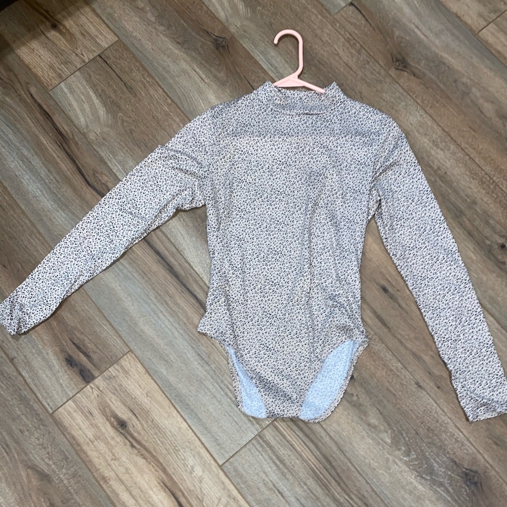 Pink cheetah print body suit